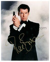 1r1182 PIERCE BROSNAN signed color 8x10 REPRO still '00s c/u James Bond portrait with gun in tuxedo!