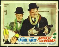 2v243 SONS OF THE DESERT LC R45 best close image of Stan Laurel & Oliver Hardy w/leis & ukulele!