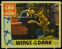 3b695 WINGS IN THE DARK LC '34 great close up of sad Cary Grant consoled by his German Shepherd!