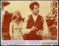 4b175 BONNIE & CLYDE LC #8 '67 close up of Faye Dunaway watching Warren Beatty load his pistol!