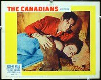 4b211 CANADIANS movie lobby card #6 '61 Robert Ryan as Royal Mounted Police comforting woman!