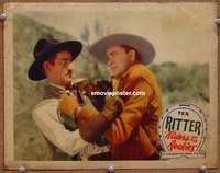 4b718 RIDERS OF THE ROCKIES lobby card '37 great image of Tex Ritter grabbing bad guy by the collar!