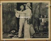 4b724 RIDING WITH DEATH movie lobby card '21 cowboy Charles Buck Jones fighting for gun!