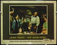 4b771 SEARCHERS LC #5 '56 John Ford, boy in shop gives big John Wayne wearing uniform his sword!