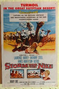 7e841 STORM OVER THE NILE 1sh '56 Laurence Harvey, turmoil in the great Egyptian desert!