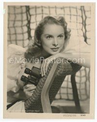 7f242 JANET LEIGH 8x10.25 still '51 seated backwards in chair holding binoculars!