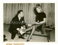 1m445 GEORGE RAFT/BETTY GRABLE 6.5x8.5 still '41 Raft helps Grable with skates!