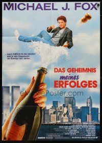 9m623 SECRET OF MY SUCCESS German '87 wacky image of Michael J. Fox & huge bottle of champagne!