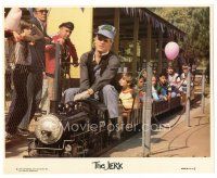 1h575 JERK 8x10 mini LC '79 c/u of wacky Steve Martin riding on tiny train with kids!