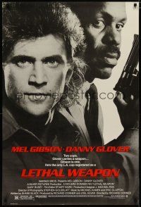 5y463 LETHAL WEAPON 1sh '87 great close image of cop partners Mel Gibson & Danny Glover!