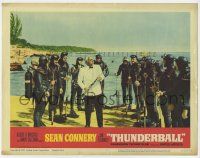 3z940 THUNDERBALL LC #7 '65 villain Adolfo Celi surrounded by frogmen demonstrates speargun!