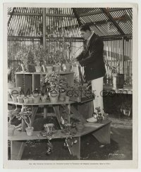 3s815 VICTOR MCLAGLEN 8.25x10 still '34 working in his transplanting shed, he's an avid gardener!