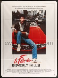 4p574 BEVERLY HILLS COP French 1p '84 great image of cop Eddie Murphy sitting on Mercedes!