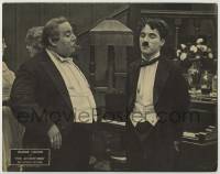 4s531 ADVENTURER LC R32 prison escapee Charlie Chaplin in tuxedo with large man by piano!