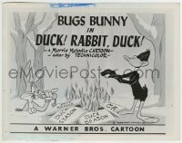 1h283 DUCK! RABBIT, DUCK! 8x10.25 still 1953 Bugs Bunny watches Daffy Duck burn duck season signs!