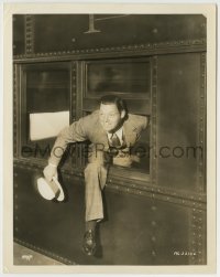 1h502 JOHNNY WEISSMULLER 8x10.25 still 1930s climbing out train window as he arrived in New York!