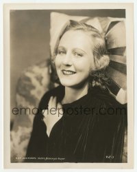 1h514 KAY JOHNSON 8x10.25 still 1930s smiling portrait in velvet dress leaning on cool pillow!