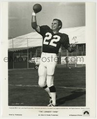 1h568 LONGEST YARD 8.25x10 still 1974 great c/u of Burt Reynolds in uniform throwing football!