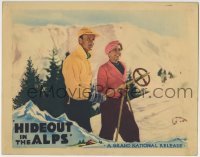 4p408 HIDEOUT IN THE ALPS LC 1937 close up of Anthony Bushell & Jane Baxter with bamboo ski poles!