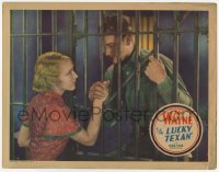 4p546 LUCKY TEXAN LC 1934 pretty Barbara Sheldon holds hands with John Wayne through jail bars!