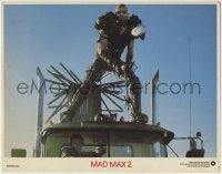 4p551 MAD MAX 2: THE ROAD WARRIOR int'l LC 1981 Vernon Wells on top of Mel Gibon's truck!