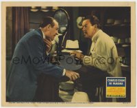 7c387 CHARLIE CHAN IN PANAMA LC 1940 Sidney Toler stares at Richards clutching neck in hat shop!