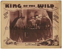 7c636 KING OF THE WILD chapter 9 LC 1931 men watch Boris Karloff light candle, The Door of Dread!