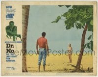 8j537 DR. NO LC #6 1962 Sean Connery as James Bond stares at sexy Ursula Andress across beach!