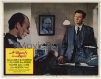 9y370 DANDY IN ASPIC LC #4 1968 close up of puzzled Laurence Harvey standing at man's desk!