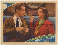 9y721 NIGHT MUST FALL LC 1937 c/u of Rosalind Russell staring at Robert Montgomery carving wood!