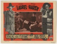 9y753 PICK A STAR LC R1940s Oliver Hardy watches Stan Laurel playing trumpet, Movie Struck!