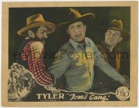 1a921 TOM'S GANG LC 1927 Tom Tyler wincing in pain as he's roughed up by two bad guys!