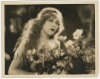 2h642 MERRY WIDOW 8x10.25 still 1925 wonderful portrait of angelic Mae Murray holding roses!