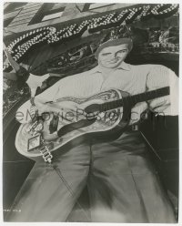 4w1423 LOVE ME TENDER candid 7.5x9.25 still 1956 attaching charm bracelet to enormous Elvis display!