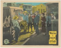 4w0655 MAN FROM UTAH LC R1930s John Wayne showing contents of stagecoach to townspeople, rare!