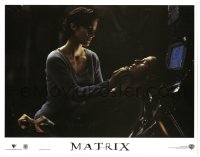 4w0661 MATRIX LC 1999 c/u of Carrie-Anne Moss as Trinity nursing wounded Keanu Reeves as Neo!