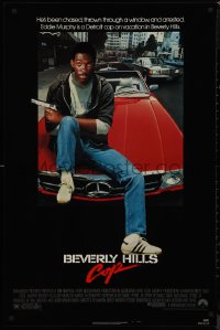 9k0664 BEVERLY HILLS COP 1sh 1984 great image of detective Eddie Murphy sitting on red Mercedes!