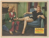 9t0351 FOOTLIGHT SERENADE LC 1942 Jane Wyman takes shoe off of dancer Betty Grable's aching foot!