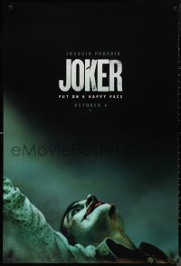 1a2544 JOKER teaser DS 1sh 2019 close-up image of clown Joaquin Phoenix, put on a happy face!