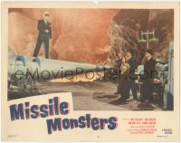 1a0843 MISSILE MONSTERS LC #5 1958 man standing on missile pointing gun at people in cave lab!