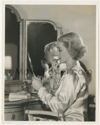 1b2266 FRONT PAGE WOMAN 8x10.25 still 1935 Bette Davis applying lipstick at her vanity by Welbourne!