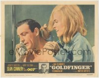 1f0617 GOLDFINGER LC #2 1964 c/u of sexy Shirley Eaton behind Sean Connery as James Bond on phone!