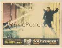 1f0612 GOLDFINGER LC #3 1964 Sean Connery as James Bond watches Oddjob get electrocuted on fence!