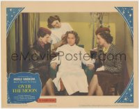 1f0672 OVER THE MOON LC 1939 close up of Merle Oberon sitting in chair having her hair done!