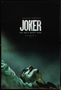 1g1254 JOKER teaser DS 1sh 2019 close-up image of clown Joaquin Phoenix, put on a happy face!