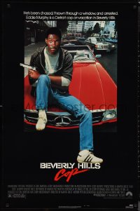 1k1103 BEVERLY HILLS COP 1sh 1984 great image of detective Eddie Murphy sitting on red Mercedes!