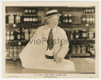 2b1781 IT'S A GIFT 8.25x10 still 1934 W.C. Fields tries to wrap pack of gum in huge wrapping paper!