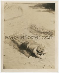 2b1799 JUNE CLYDE deluxe 8x10 still 1932 on the beach using cellophane blanket to prevent sunburn!