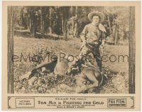 2p1265 FIGHTING FOR GOLD LC 1919 Tom Mix with two guns drawn standing over his fallen horse!