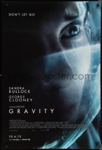 2r0952 GRAVITY advance DS 1sh 2013 super close up of astronaut Sandra Bullock, don't let go!